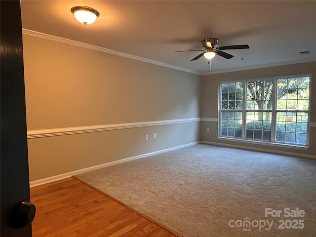 5236 Hilltop Rd, Jamestown, NC 27282 - carpeted empty room featuring ceiling fan, ornamental molding, and wood finished floors