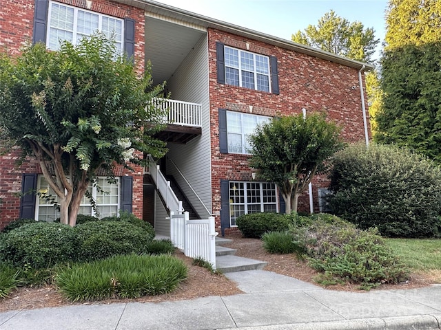 5236 Hilltop Rd, Jamestown, NC 27282 - view of front of house featuring brick siding and a balcony
