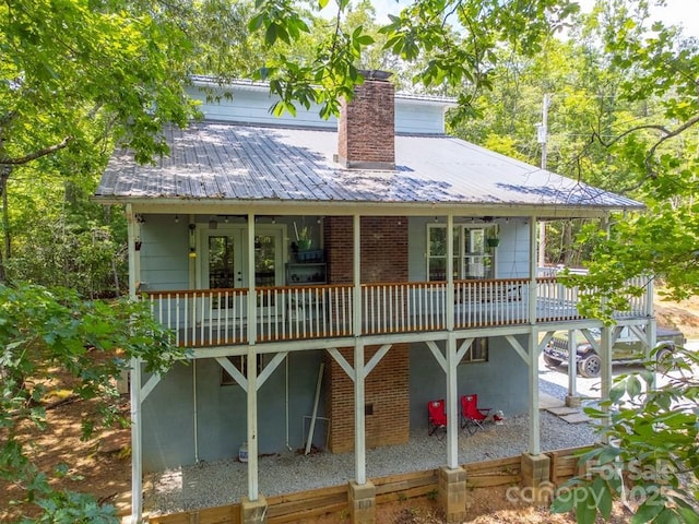 155 Notta Rd, Franklin, NC 28734 - back of property featuring a metal roof, a wooden deck, a chimney, and french doors