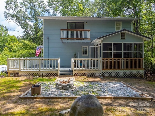 155 Notta Rd, Franklin, NC 28734 - back of house with an outdoor fire pit, a sunroom, and a wooden deck