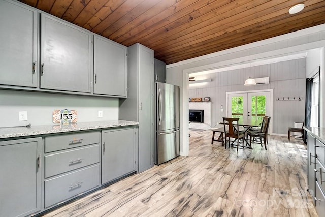 155 Notta Rd, Franklin, NC 28734 - kitchen featuring freestanding refrigerator, gray cabinets, wood ceiling, and light wood-style floors