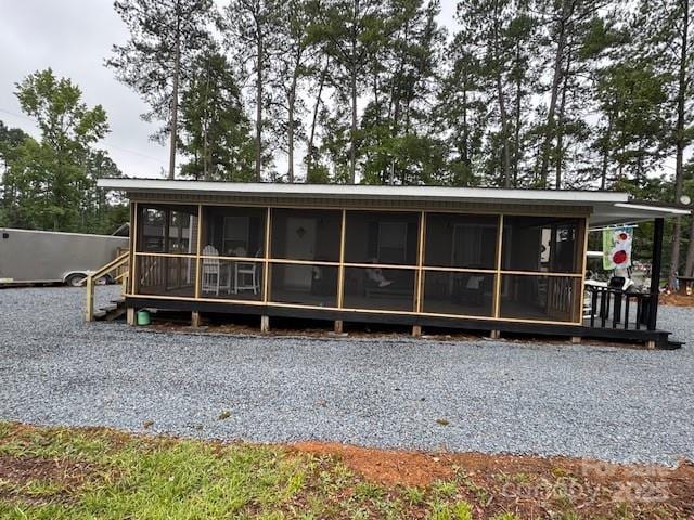 103 Holly Harbor Trl Unit 348A, Mount Gilead, NC 27306 - back of house featuring a sunroom