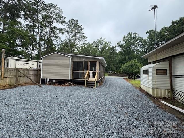 103 Holly Harbor Trl Unit 348A, Mount Gilead, NC 27306 - view of outdoor structure featuring a sunroom