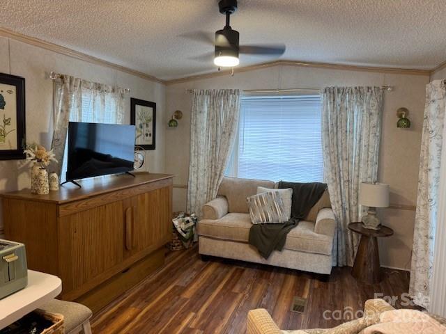 103 Holly Harbor Trl Unit 348A, Mount Gilead, NC 27306 - living area featuring crown molding, wood finished floors, a textured ceiling, a ceiling fan, and lofted ceiling