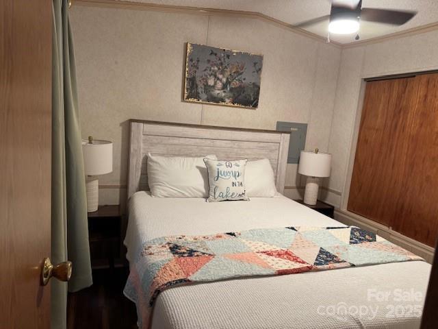 103 Holly Harbor Trl Unit 348A, Mount Gilead, NC 27306 - bedroom featuring ornamental molding, a ceiling fan, and a closet