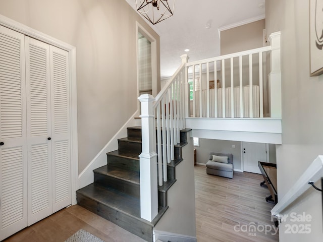 607 W School St, Maiden, NC 28650 - stairs featuring wood finished floors, a chandelier, and recessed lighting