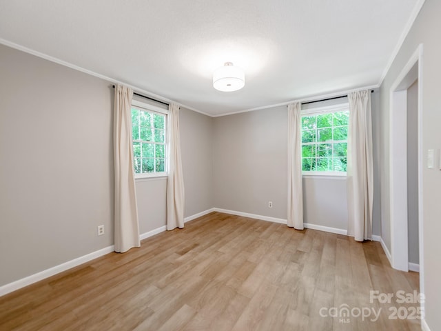 607 W School St, Maiden, NC 28650 - unfurnished room with light wood-style flooring, healthy amount of natural light, and crown molding