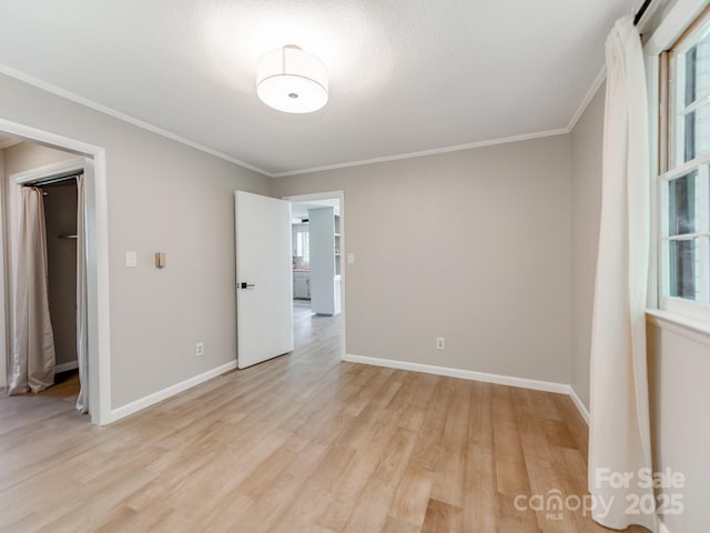 607 W School St, Maiden, NC 28650 - empty room featuring light wood-style flooring and crown molding