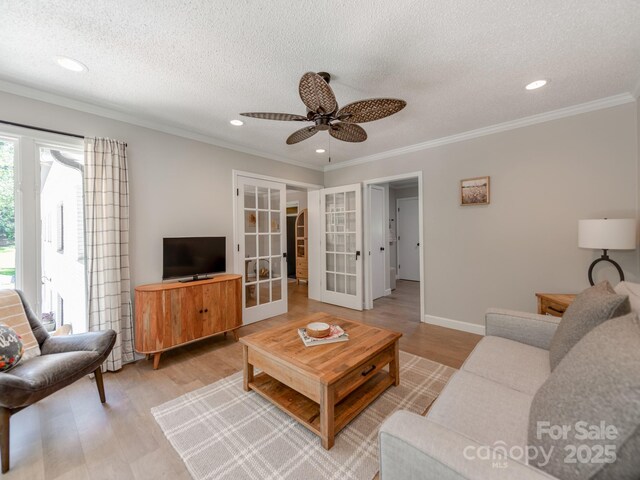 607 W School St, Maiden, NC 28650 - living room with french doors, a ceiling fan, a textured ceiling, light wood-type flooring, and recessed lighting