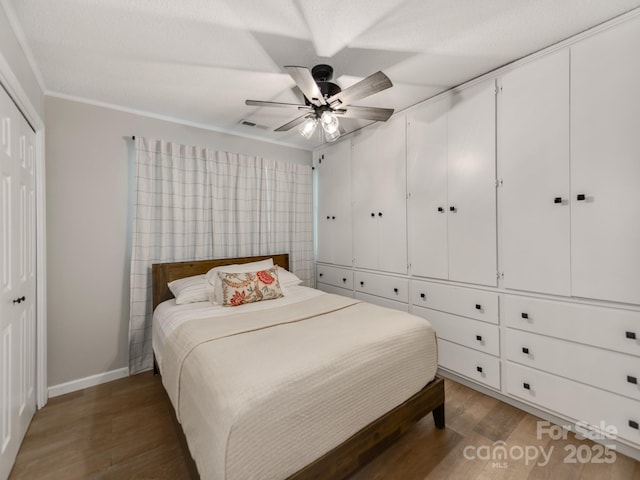 607 W School St, Maiden, NC 28650 - bedroom with wood finished floors, a closet, a ceiling fan, and crown molding