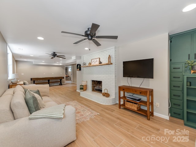 607 W School St, Maiden, NC 28650 - living area with recessed lighting, light wood finished floors, ceiling fan, and a fireplace