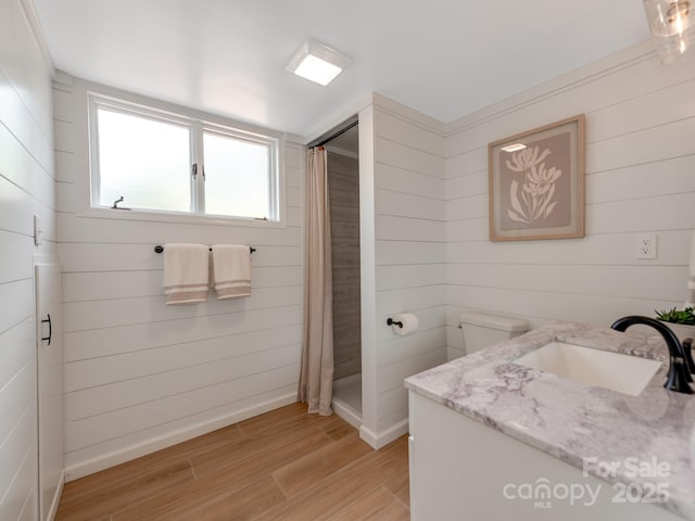 607 W School St, Maiden, NC 28650 - full bath with wood walls, wood finished floors, vanity, and a shower with curtain