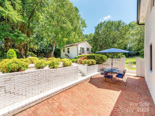 607 W School St, Maiden, NC 28650 - view of patio featuring outdoor dining space and view of scattered trees