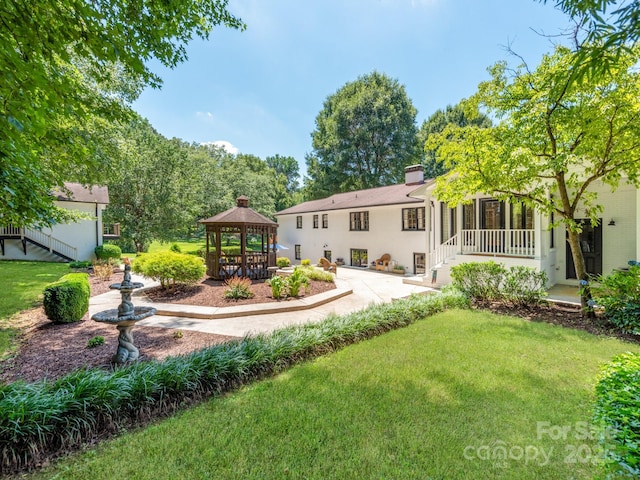 607 W School St, Maiden, NC 28650 - back of house featuring a gazebo, a lawn, and a chimney