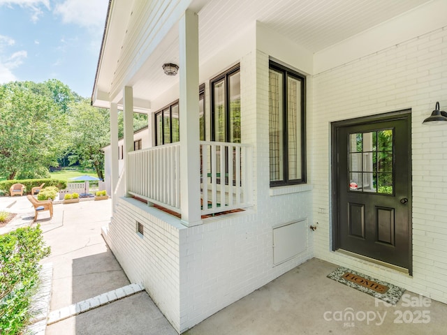 607 W School St, Maiden, NC 28650 - entrance to property featuring brick siding and a porch
