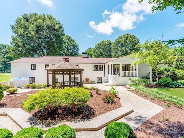 607 W School St, Maiden, NC 28650 - rear view of house with a gazebo, a chimney, stucco siding, and a porch