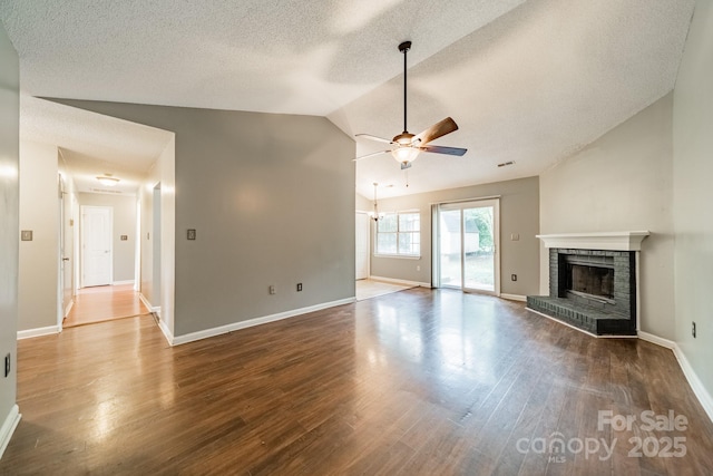8027 Sherington Way, Charlotte, NC 28227 - unfurnished living room featuring lofted ceiling, a fireplace, a ceiling fan, a textured ceiling, and wood finished floors