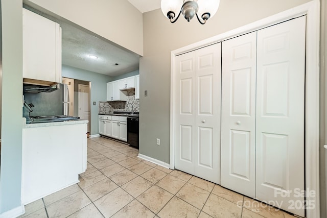 8027 Sherington Way, Charlotte, NC 28227 - kitchen featuring decorative backsplash, white cabinets, a chandelier, dishwasher, and wall chimney exhaust hood