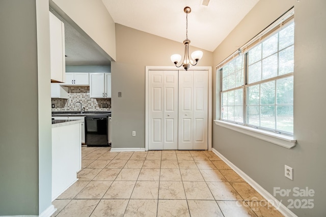 8027 Sherington Way, Charlotte, NC 28227 - unfurnished dining area with a chandelier and lofted ceiling