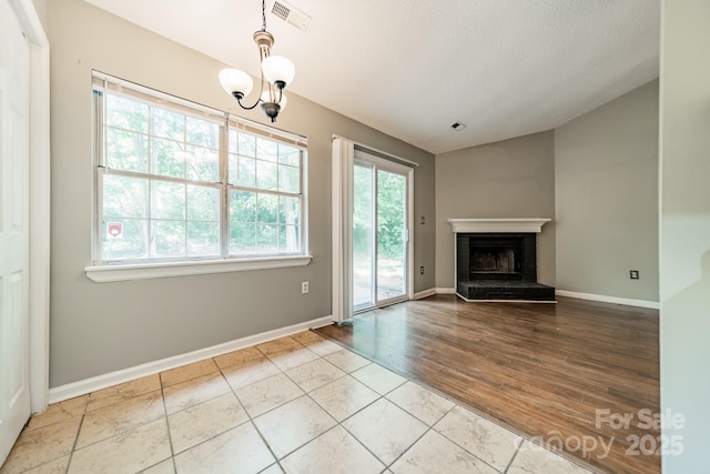 8027 Sherington Way, Charlotte, NC 28227 - unfurnished living room with a fireplace, lofted ceiling, and a textured ceiling