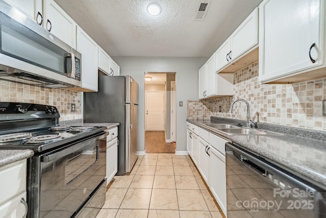8027 Sherington Way, Charlotte, NC 28227 - kitchen featuring black appliances, a textured ceiling, white cabinets, tasteful backsplash, and light tile patterned floors