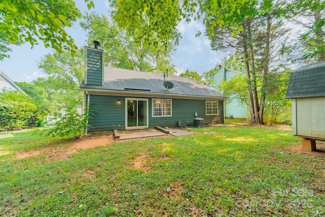 8027 Sherington Way, Charlotte, NC 28227 - rear view of house featuring a chimney, a lawn, a patio, and a shingled roof