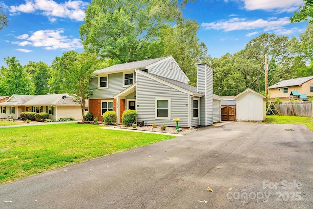 15804 Fairfield Dr, Matthews, NC 28104 - view of front of property with a chimney, driveway, and brick siding