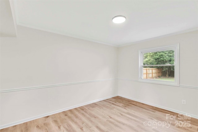 15804 Fairfield Dr, Matthews, NC 28104 - empty room with ornamental molding and light wood finished floors