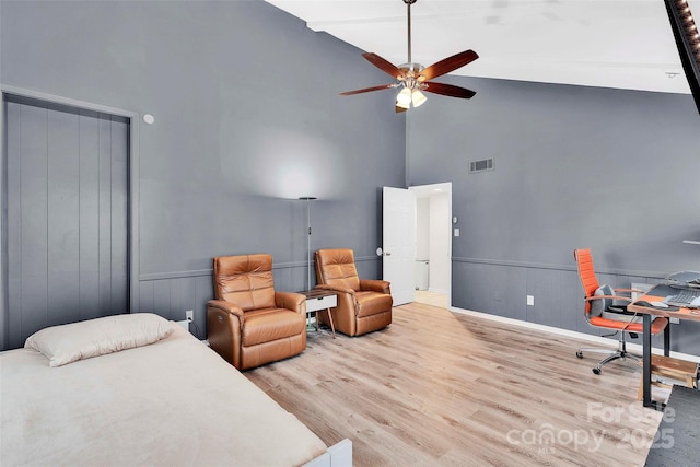 15804 Fairfield Dr, Matthews, NC 28104 - bedroom with high vaulted ceiling, wood finished floors, an office area, ceiling fan, and wainscoting