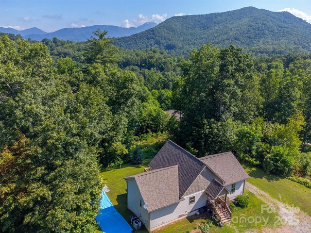 266 Egret Ln, Sylva, NC 28779 - view from above of property featuring a heavily wooded area and a mountain backdrop