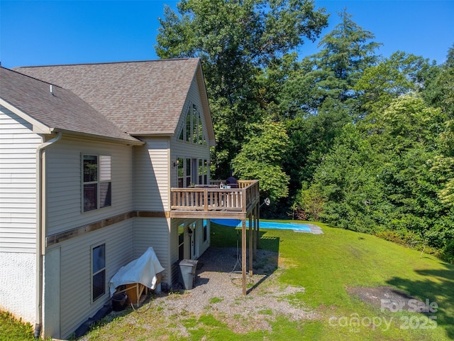 266 Egret Ln, Sylva, NC 28779 - rear view of house with a deck, a lawn, and a shingled roof