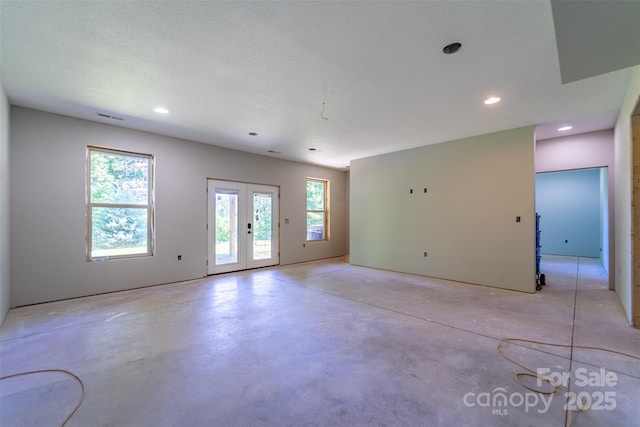 266 Egret Ln, Sylva, NC 28779 - empty room featuring concrete flooring, recessed lighting, and french doors