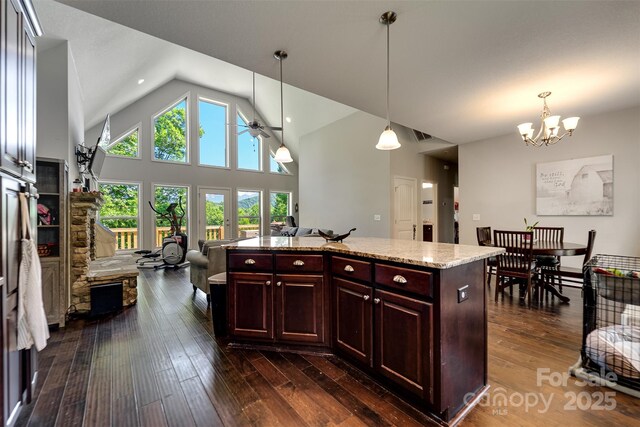 266 Egret Ln, Sylva, NC 28779 - kitchen featuring ceiling fan, a chandelier, vaulted ceiling, dark wood-type flooring, and hanging light fixtures