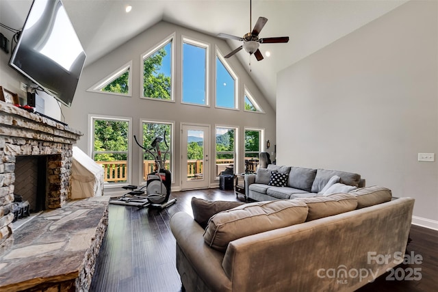 266 Egret Ln, Sylva, NC 28779 - living area with a fireplace, a ceiling fan, dark wood-type flooring, high vaulted ceiling, and recessed lighting