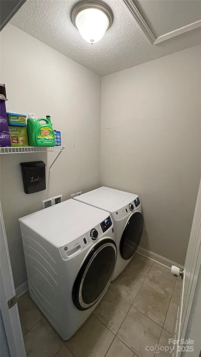 266 Egret Ln, Sylva, NC 28779 - washroom with washing machine and clothes dryer, tile patterned flooring, and a textured ceiling
