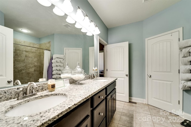 266 Egret Ln, Sylva, NC 28779 - full bathroom with double vanity, a tile shower, and tile patterned flooring