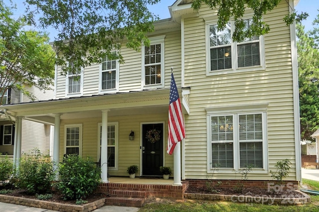 10306 Meadow Crossing Ln, Cornelius, NC 28031 - view of front facade with a porch