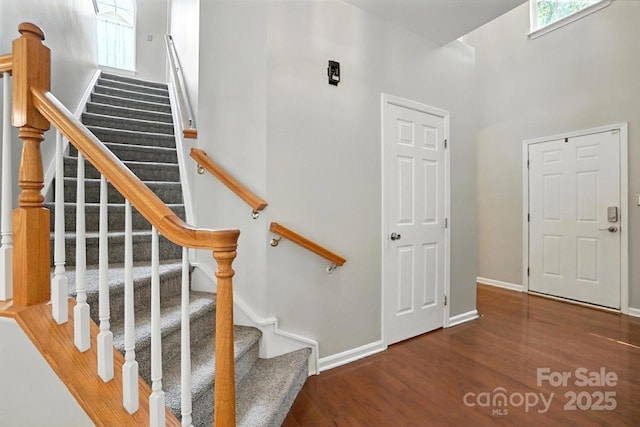 10306 Meadow Crossing Ln, Cornelius, NC 28031 - staircase featuring wood finished floors and baseboards
