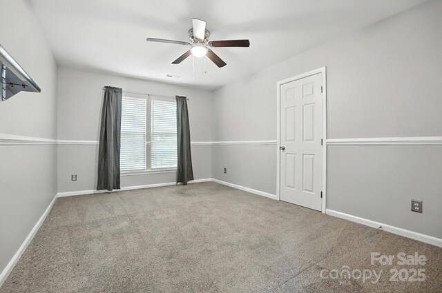 10306 Meadow Crossing Ln, Cornelius, NC 28031 - spare room featuring ceiling fan and carpet floors