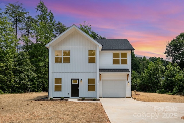 794 Stanley Spencer Mtn Rd, Gastonia, NC 28056 - view of front of home featuring a shingled roof, concrete driveway, board and batten siding, and an attached garage