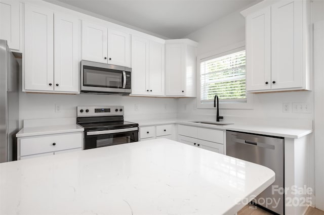 794 Stanley Spencer Mtn Rd, Gastonia, NC 28056 - kitchen featuring stainless steel appliances, white cabinets, and light stone countertops