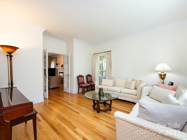 9413 Tillot Dr, Matthews, NC 28105 - living area featuring ornamental molding, light wood-style flooring, and french doors