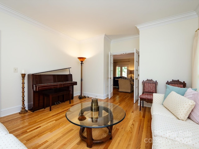 9413 Tillot Dr, Matthews, NC 28105 - living room featuring light wood-style flooring and crown molding