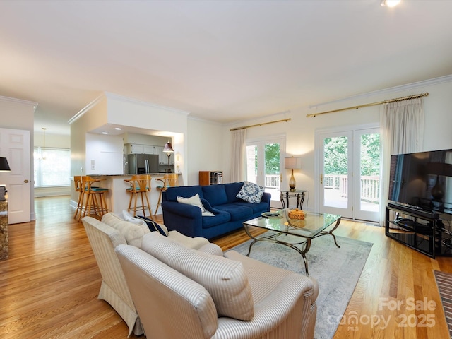 9413 Tillot Dr, Matthews, NC 28105 - living area featuring crown molding and light wood-type flooring