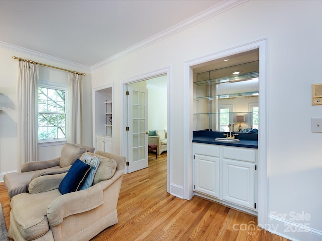 9413 Tillot Dr, Matthews, NC 28105 - sitting room with ornamental molding, light wood-type flooring, plenty of natural light, and french doors