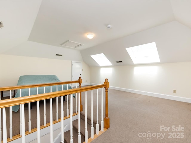 9413 Tillot Dr, Matthews, NC 28105 - bonus room with vaulted ceiling, a skylight, and light carpet