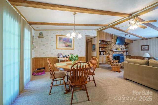 2310 Alexis Lucia Rd, Stanley, NC 28164 - dining area featuring wainscoting, wallpapered walls, light colored carpet, a ceiling fan, and wooden walls