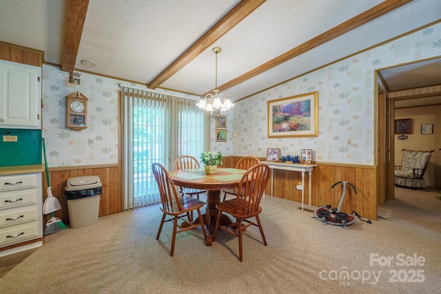2310 Alexis Lucia Rd, Stanley, NC 28164 - carpeted dining room featuring wainscoting, wood walls, wallpapered walls, and a chandelier