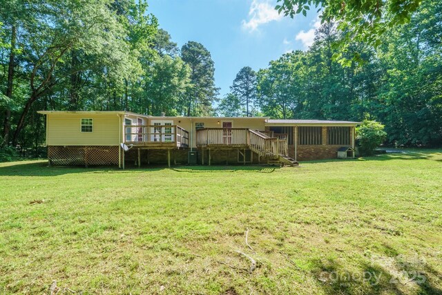 2310 Alexis Lucia Rd, Stanley, NC 28164 - back of house with stairway, a deck, a yard, and a sunroom