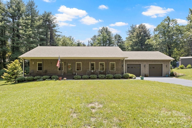 99 Pinecrest Estates Dr, Flat Rock, NC 28731 - ranch-style house with a garage, covered porch, a front lawn, and driveway